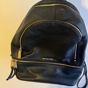 Hey guys! This Michael Kors black backpack is very stylish and in great shape!!